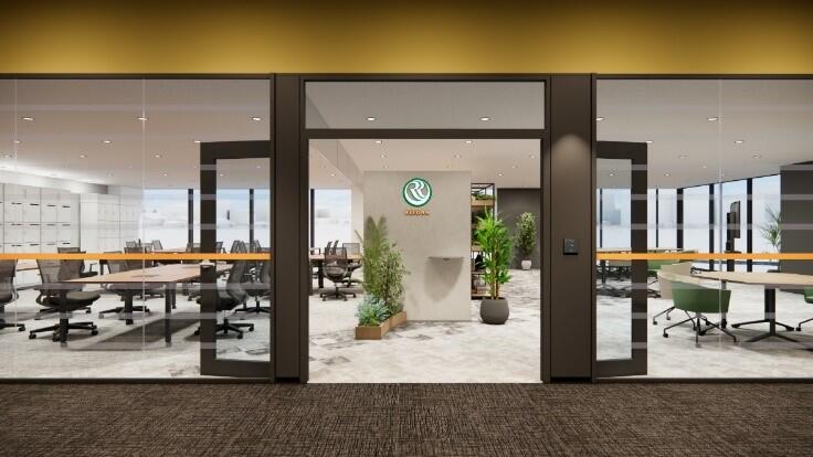 オフィスのエントランス兼ワークスペースへの入り口部分です。全面のガラスパーティション越しに、奥の執務エリアまで見通せる、開放的で透明感のあるデザインになっています